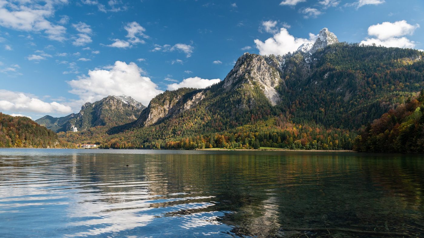 The Alpsee water with the mountains behind.