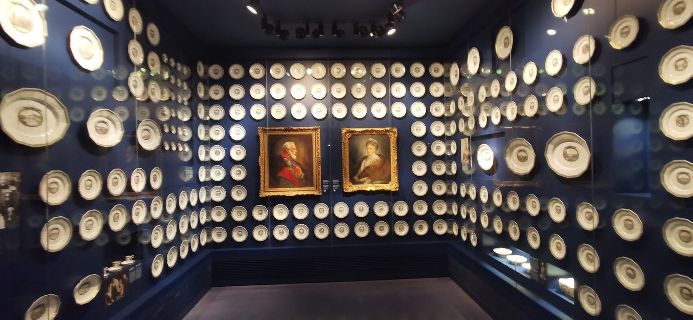 A wall of portraits on display inside the museum.